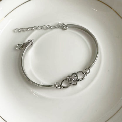 K & S | Damen Armreif Unendlichkeit mit Kristall Herz – Eleganter Schmuck & Romantische Geschenkidee